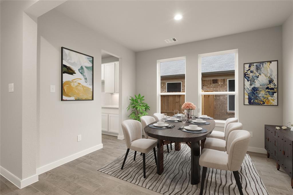 Make memories gathered around the table with your family and friends! This dining room features high ceilings, custom paint, gorgeous flooring and large windows.