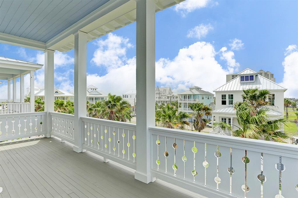 Private master bedroom covered porch with views of beach and village.
