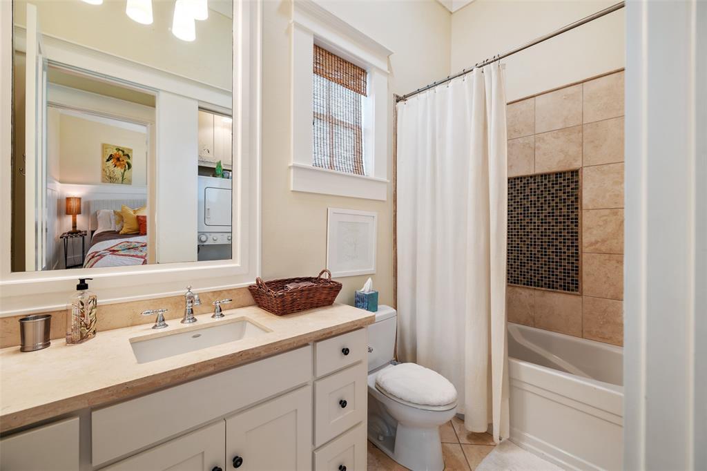 Carriage house bathroom with tub shower.