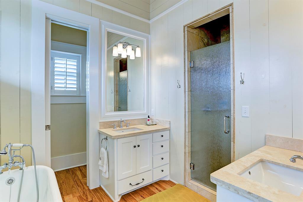 Master bath with double sinks, shower plus soaker tub, and separate water closet