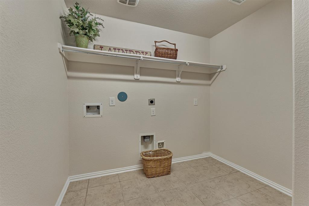 Large laundry room has both gas and electric gas connections,