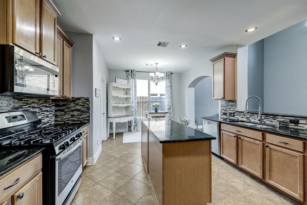 Beautiful granite and stacked tile backsplash make this gourmet kitchen a chef's dream!