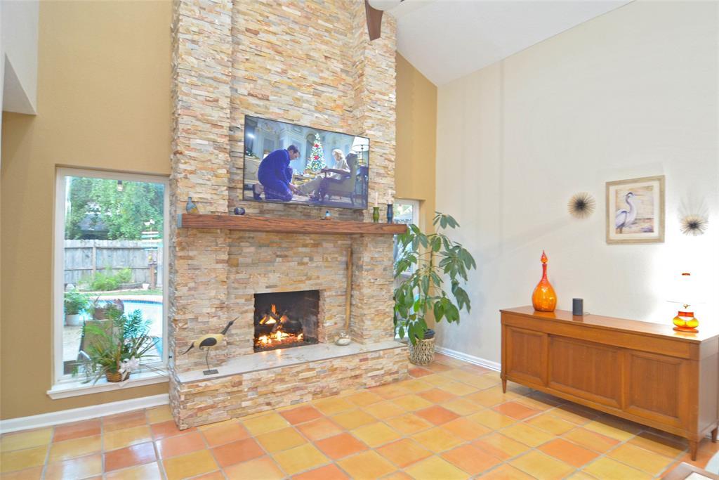 Spacious living room with a recentlyremodeled fireplace.