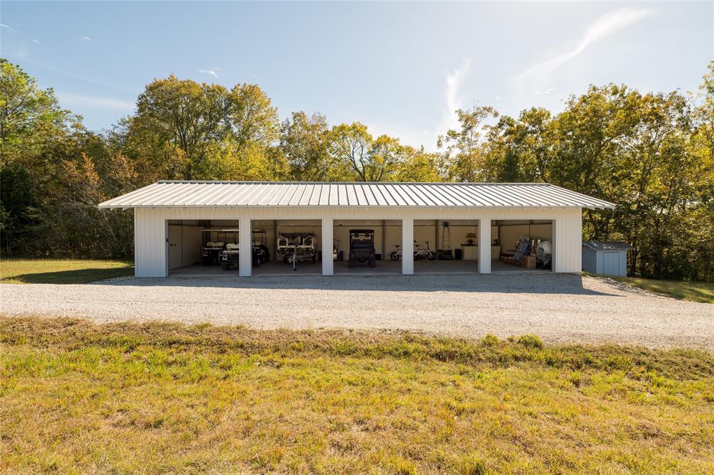 5-vehicle garage with tin roofing