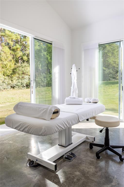 Unwind in the spa room that includes a plush massage table for your enjoyment