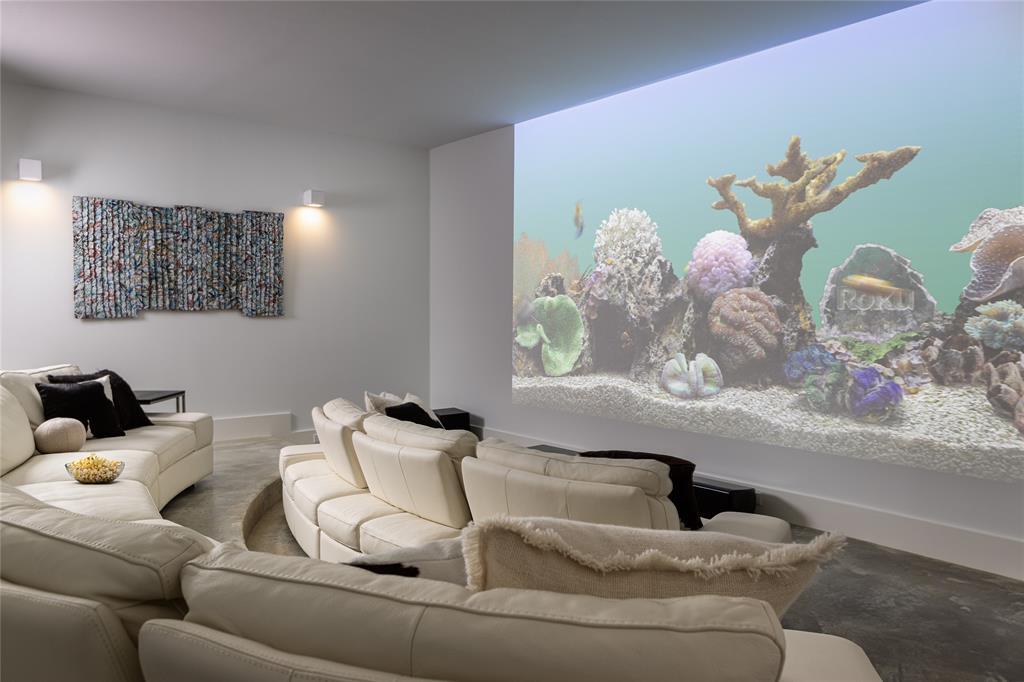 The cinema room includes dimmable sconces