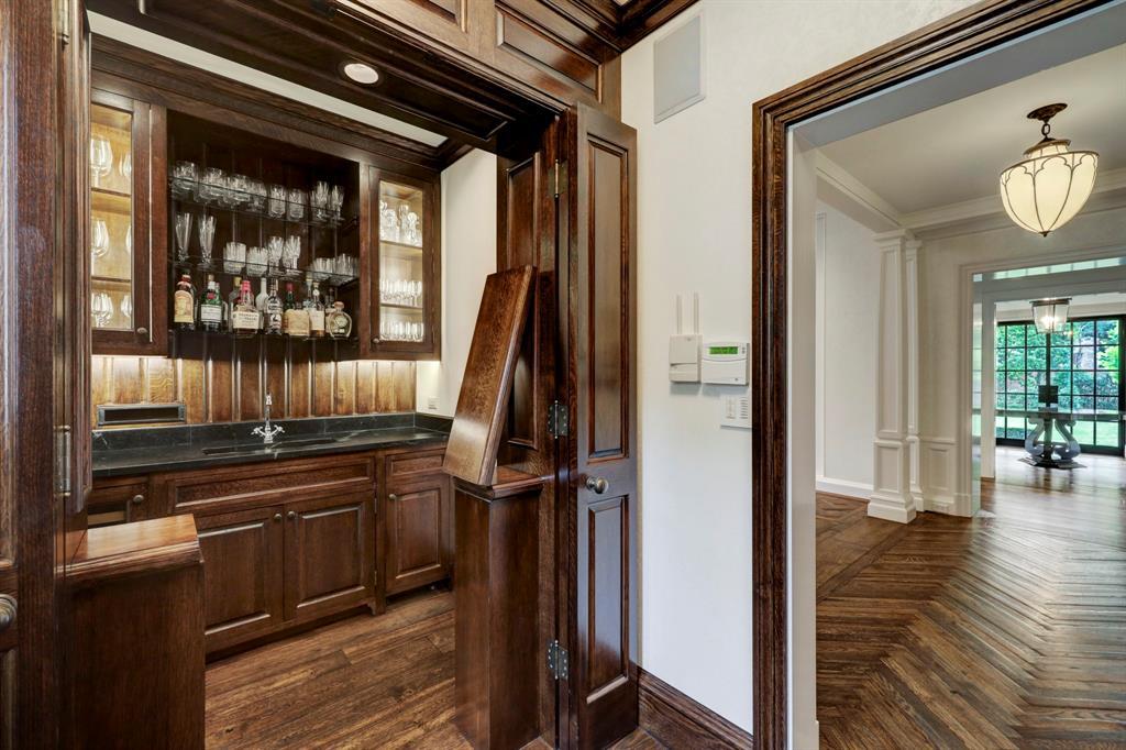 Well-appointed Wet Bar off foyer. Coat closet is also located in this alcove.