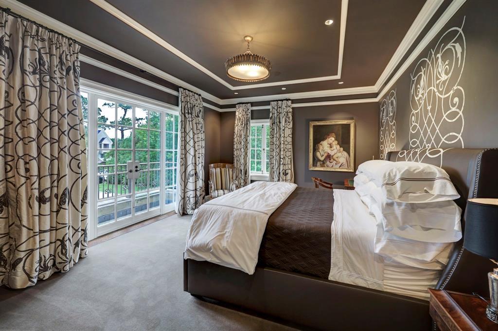Upstairs to The Guest Suite with custom Arena wallpaper adn draperies. French doors to balcony overlooking front yard.
