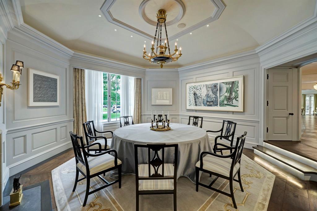 The Formal Dining Room is octagonal in shape. Views to front yard. Access to foyer is shown. There is also access to the butler's pantry leading to kitchen.