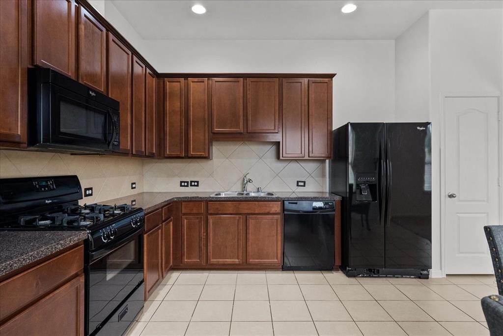 Lots of storage space in these beautiful cabinets.  The refrigerator may convey with the home! Spacious pantry conveniently located.