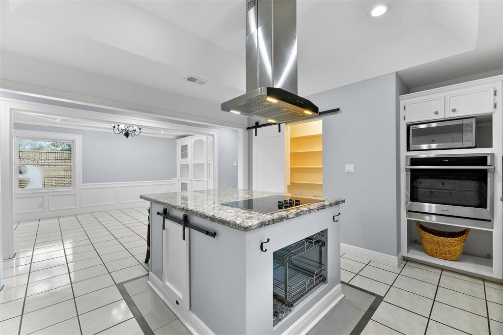 A few other noteworthy features in this kitchen include pull-out pots & pans racks beneath the cooktop, space to add a double oven, an extra roomy pantry, and a coffee bar station as well as a built-in beverage fridge.