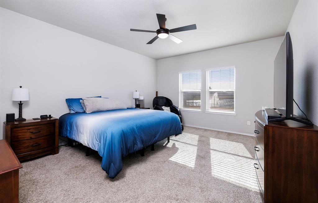 Large Primary bedroom with views of community lake.