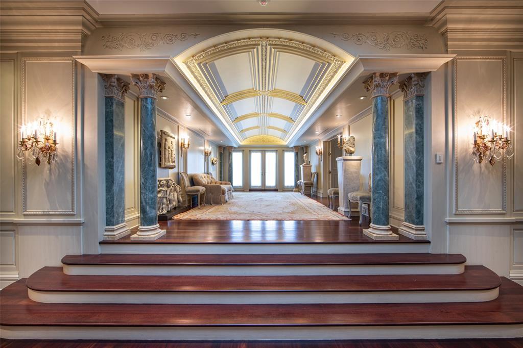 The Gallery Terrace Hall tempts you to a rear marble Terrace overlooking the grounds with marble columns, barrel-vaulted ceilings and tall French doors.