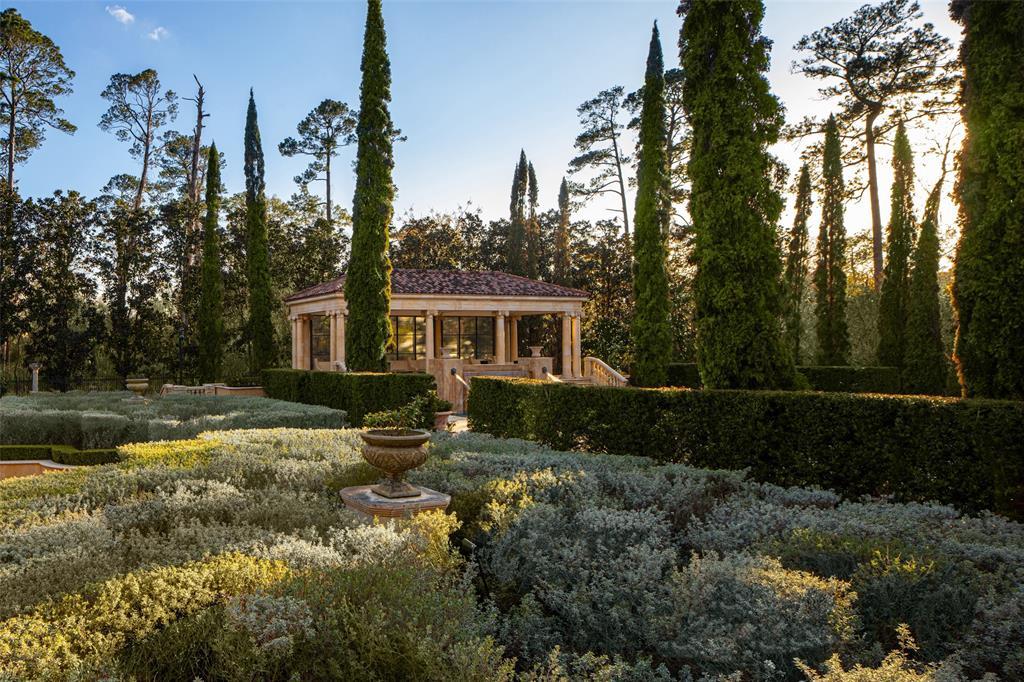 Manicured hedges and flower gardens invite you to promenade alongside a raised pavilion that encircles a secluded spa.