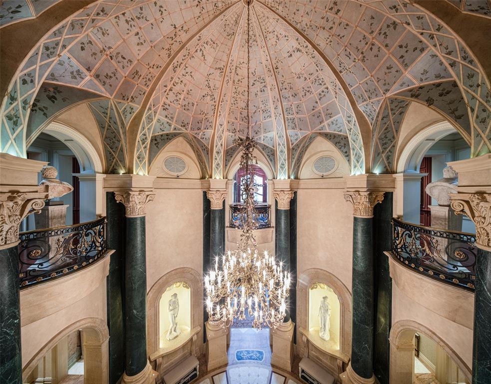 From the upper level, enjoy an up-close view of the majesty and intricacy of the domed Rotunda's hand-painted ceiling filled with vining leaves and latticework, creating a trompe l'oeil window effect.