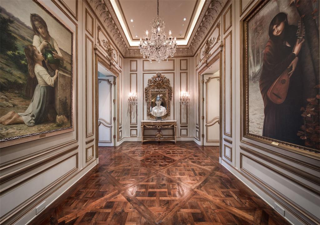 A French salon vestibule with vintage doors, paneled walls and a soaring cove ceiling introduce the secluded owner's retreat offering optimal serenity and privacy in its own wing at the end of the West Gallery.
