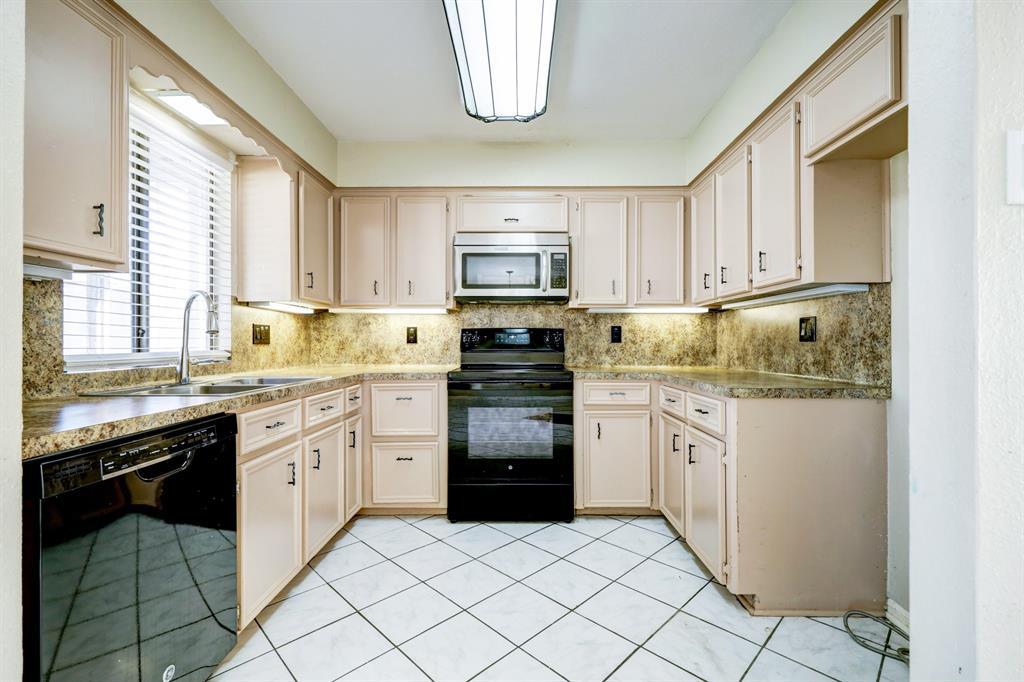 Kitchen is located just off the living room and dining room.  Lots of counter space and cabinet storage!