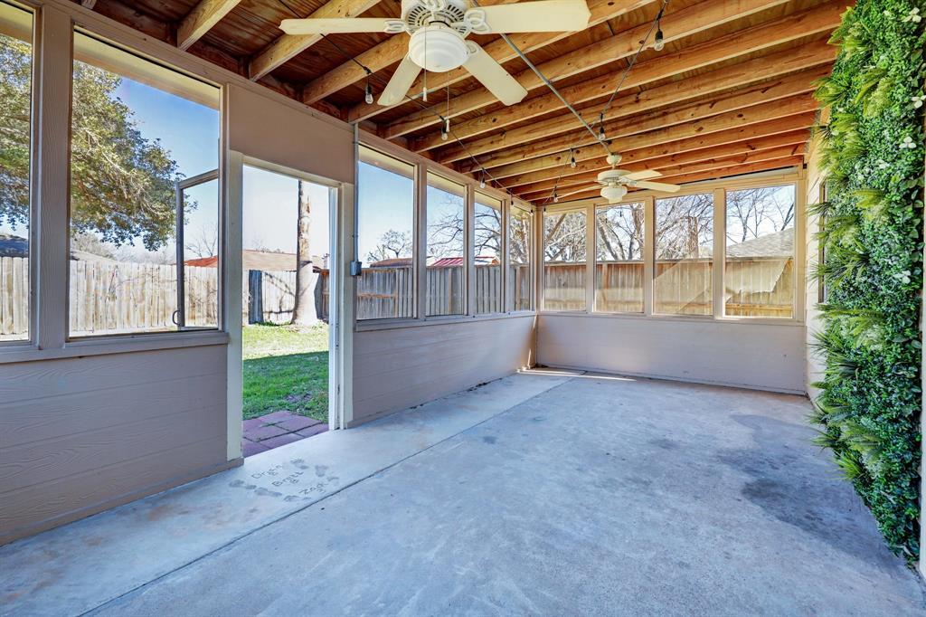 Enclosed patio/sunroom, just off the kitchen and dining room!  The perfect place to relax and unwind outdoors!