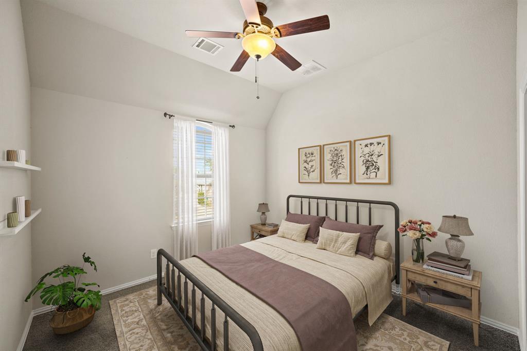 Perfect as a guest suite, the third bedroom with ensuite bath has a high ceiling with ceiling fan & lighting, window with blinds & carpet. This photo has been virtually staged.