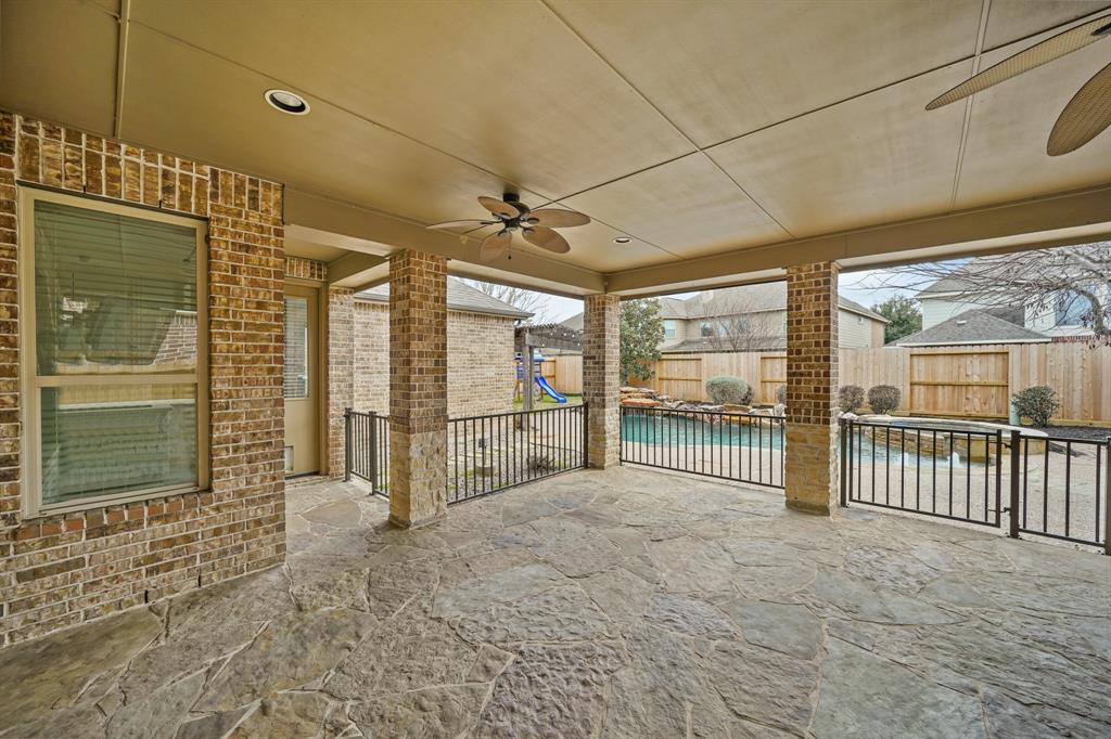 The 18' x 18' covered patio supported by decorative brick columns with stone accents and plenty of space for outdoor furniture has recessed lighting, two ceiling fans & flagstone flooring. A wrought iron fence offers peace of mind for those with pets & small children! Welcome home to 17719 Eavedown Court in Coppers Lake where homeowner's enjoy a multitude of amenities including a beautiful swimming pool & clubhouse as well as tennis courts and a kids play area.