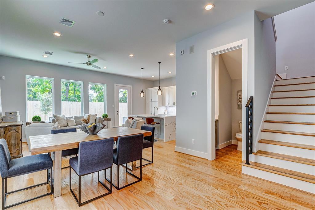 Open floor plan showcases how spacious the first floor is. An abundance of natural light and a smooth textured finish paint on the walls create a relaxing atmosphere.