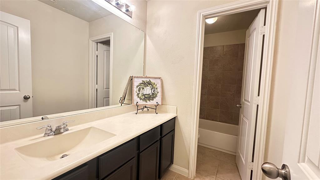 Secondary bathroom that serves the 2nd floor bedrooms has large counter space and plenty of storage