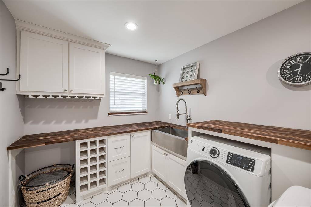 Innovative utility room next to the kitchen offers a creative flex space for food prep, butler's pantry, laundry, crafting, and more.