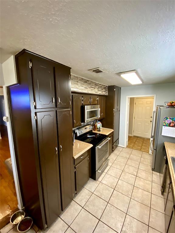 Kitchen with access to laundry room