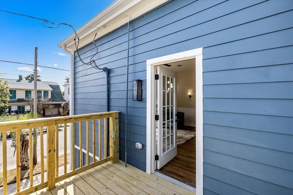 Side door leads to a brand new deck. Grab a chair! Entry way to the left is a bedroom.