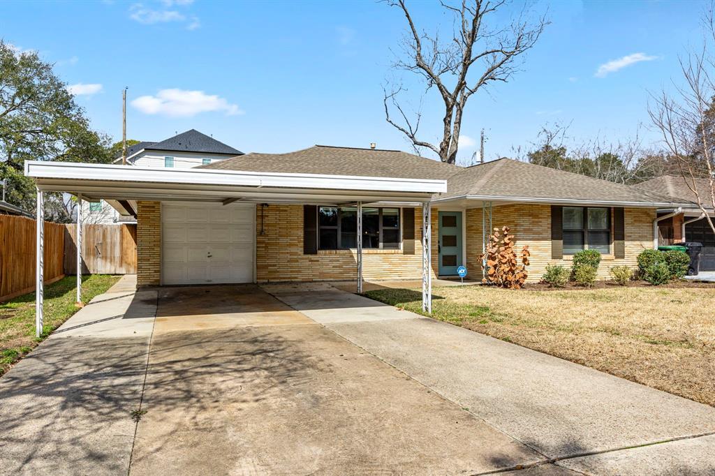 Large lot with a double wide driveway, garage and carport!  A rare find in Oak Forest!