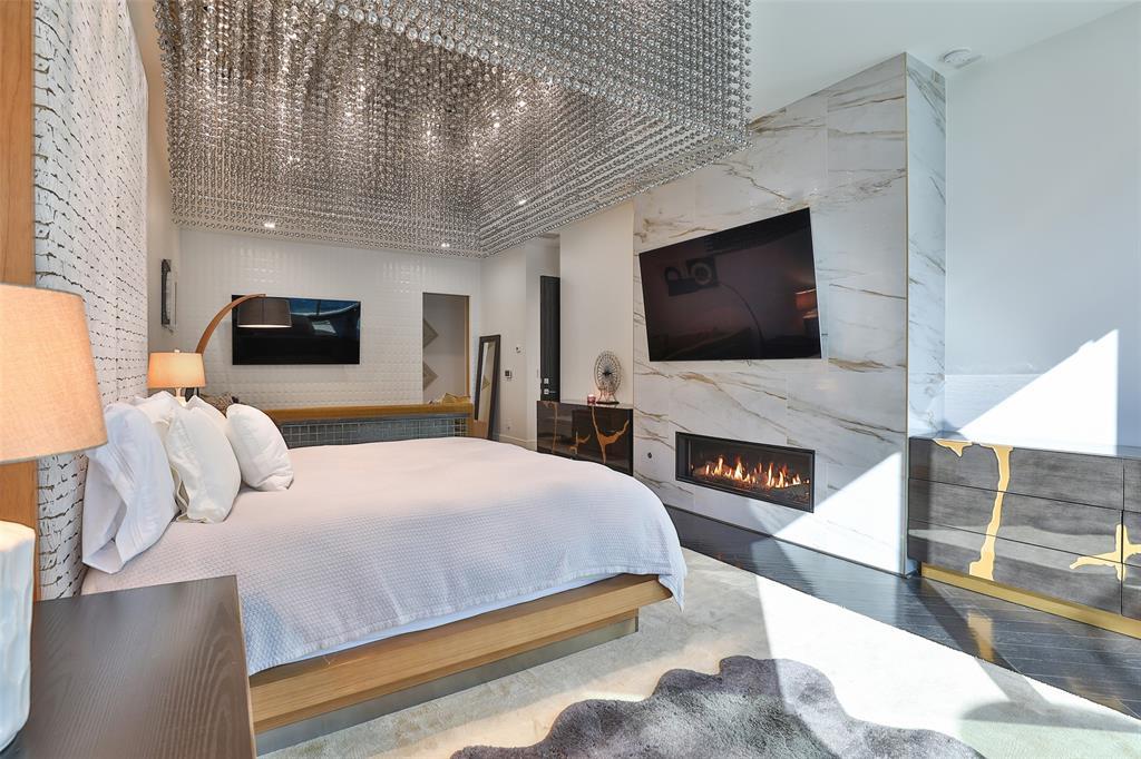 Imagine waking up in a 5 STAR resort every day of your life overlooking the pool! The custom chandelier shrouding the bed is simply jaw dropping with 800 smoke gray crystal acrylic beads and a stainless polished chrome mirrored surface finish above.