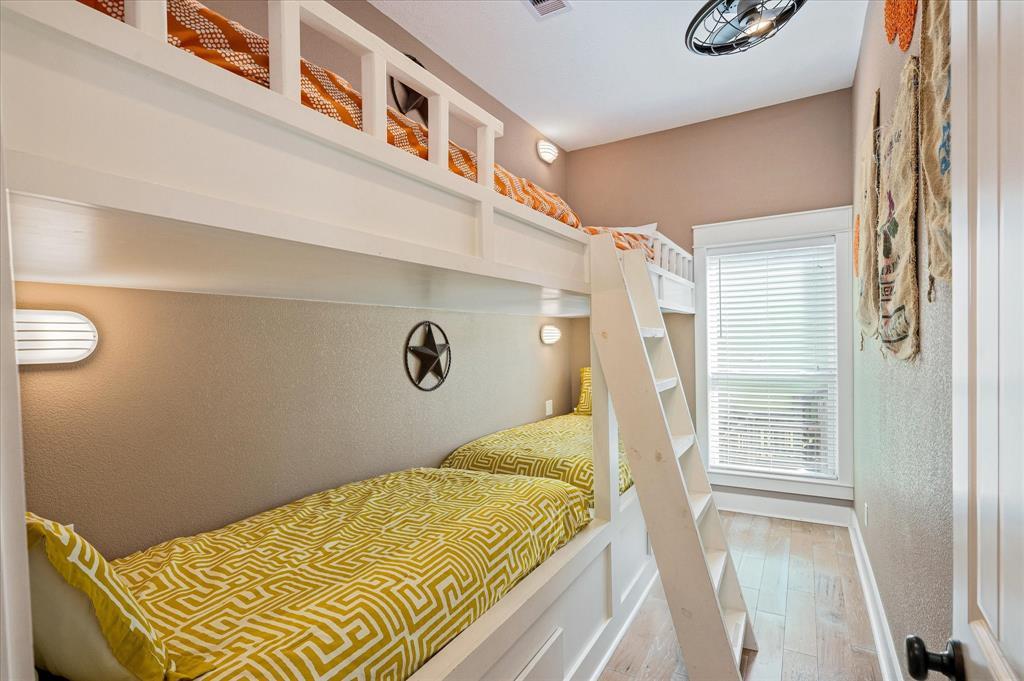 Four bunkbeds in a secondary bedroom maximize sleep space-each with reading light and electrical outlet.