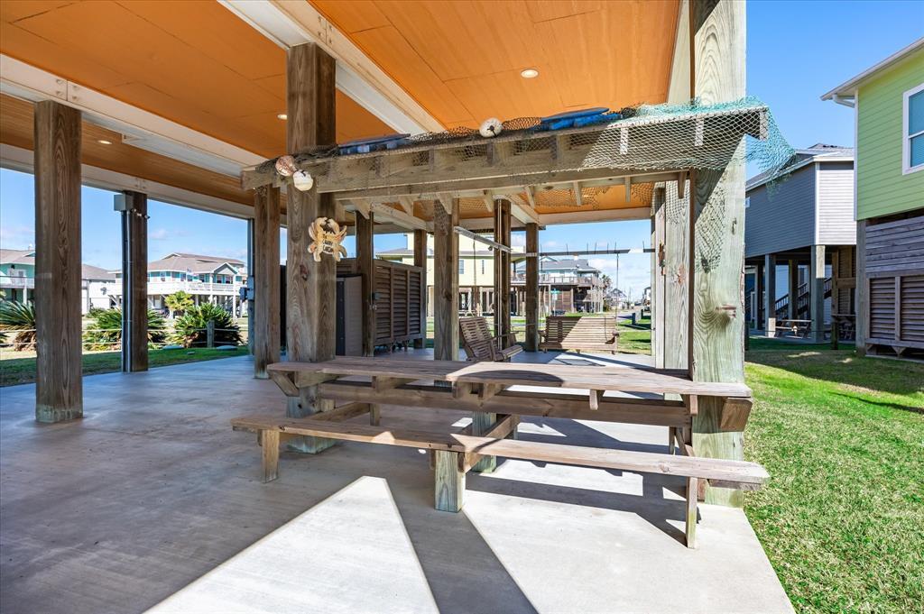 Beach parties are easy with a built-in picnic table, porch swings and so much shaded space. Memories to last a life time are certain to happen here.