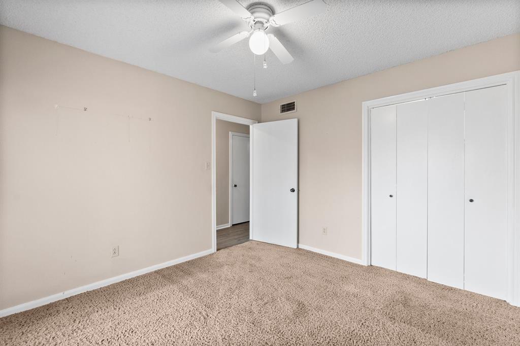 A cross room photo from the large picture window in this bedroom with the extra wide walk-in closet doors.