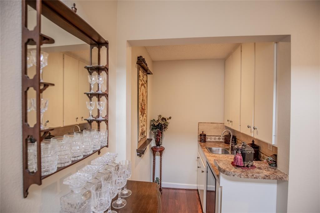 Built-in wet bar with wine refrigerator and plenty of storage.