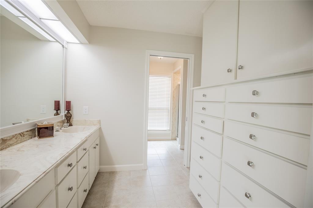 Notice the built-in storage across from the vanity.