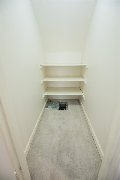 A closet in the house that contains a floor safe.