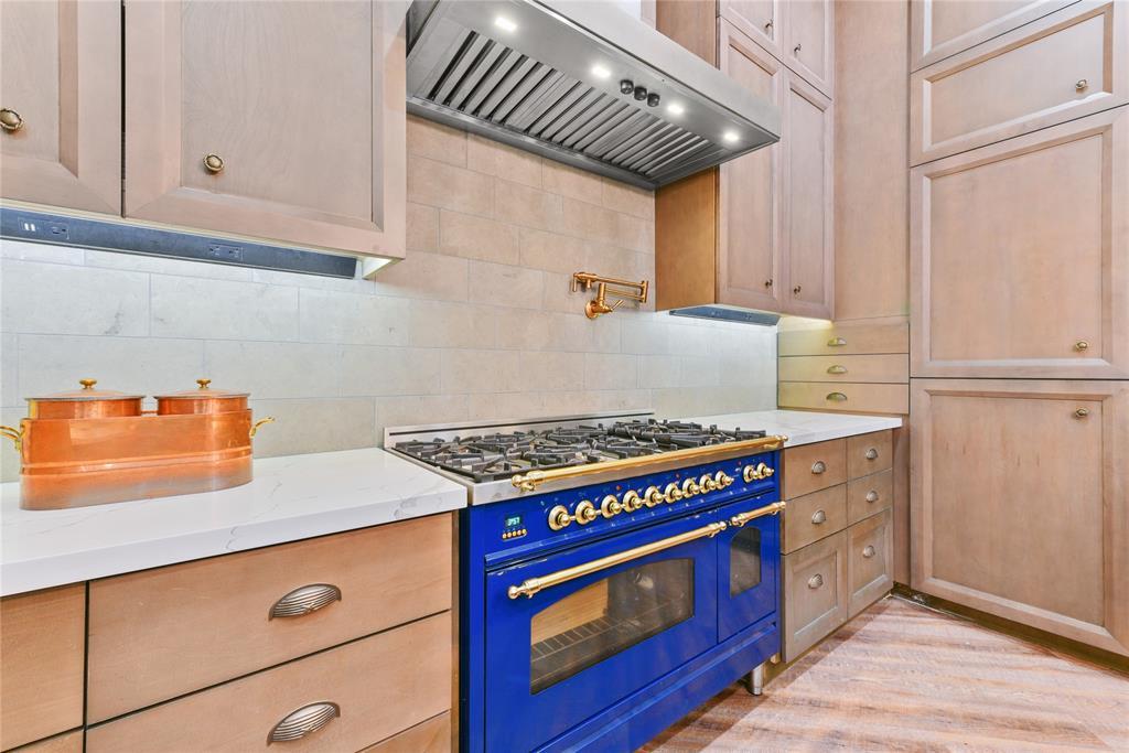 When the kitchen was completely renovated in 2022, all new finishes were introduced as well as this beautiful French gas range including vent hood above and pot filler.