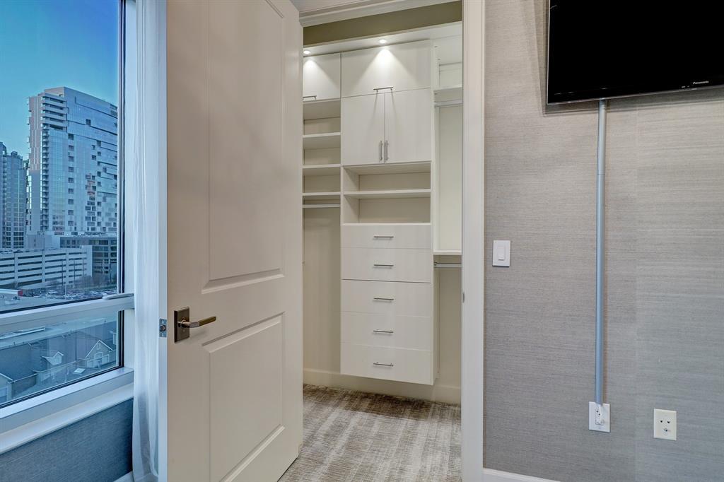 This closet in the secondary bedroom has ample space.