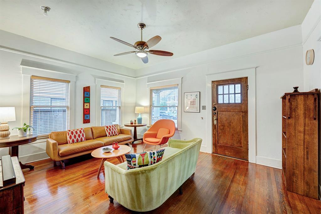 Once inside you are greeted by original hardwood floors, high ceilings and front living room.