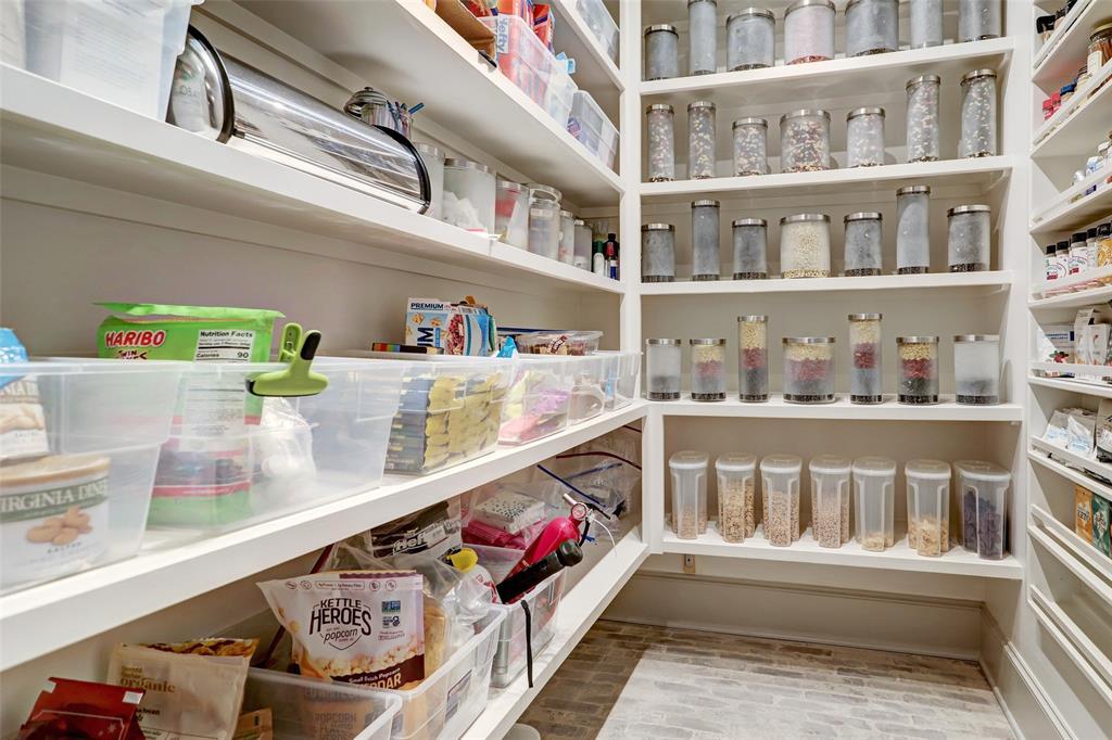 Walk in pantry offers plenty space to make your Marie Kondo dreams come true.
