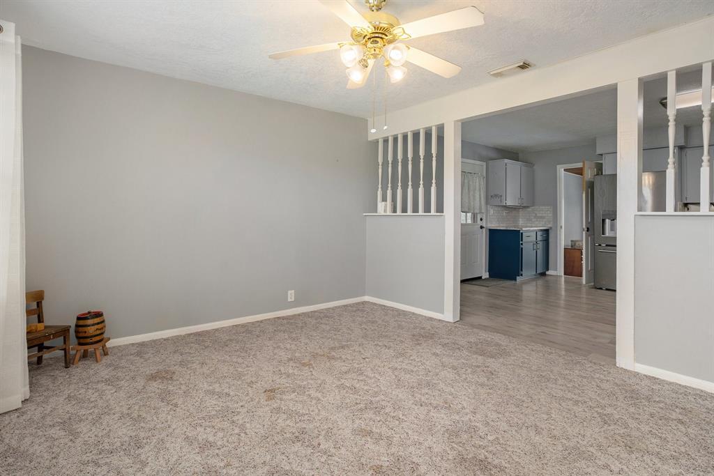 As you walk through the front door you will find the first living area that is open to the kitchen and dining area.