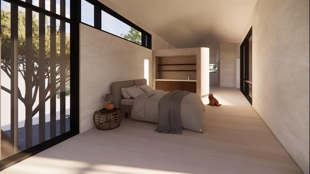 Serene bedroom space with a large window that frames the view of the outdoors.
