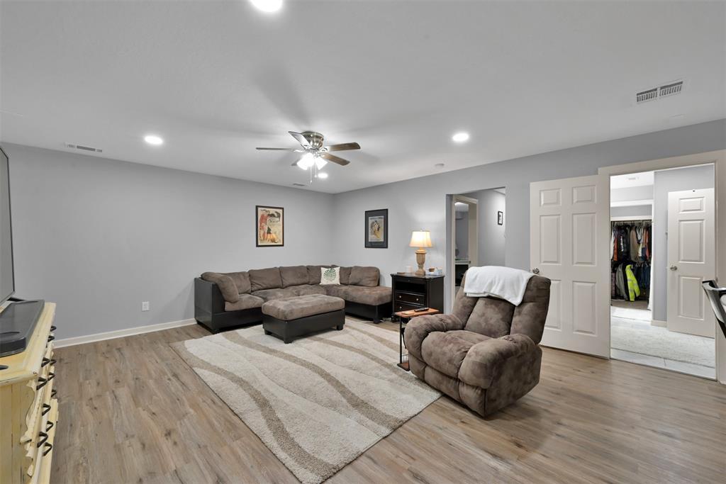 (Unit A) Spacious and flexible living room accommodates several furniture arrangements.