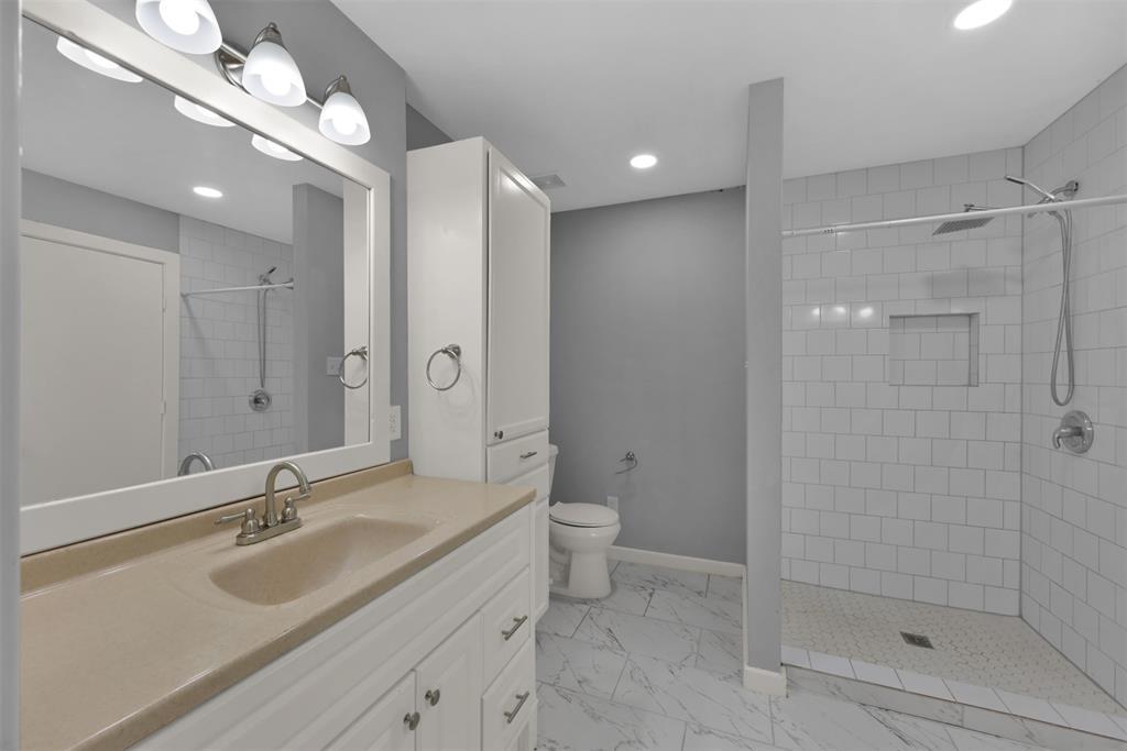 (Unit B) The primary bathroom features built-in storage space & two separate sink areas so there's no stress in the morning routine!