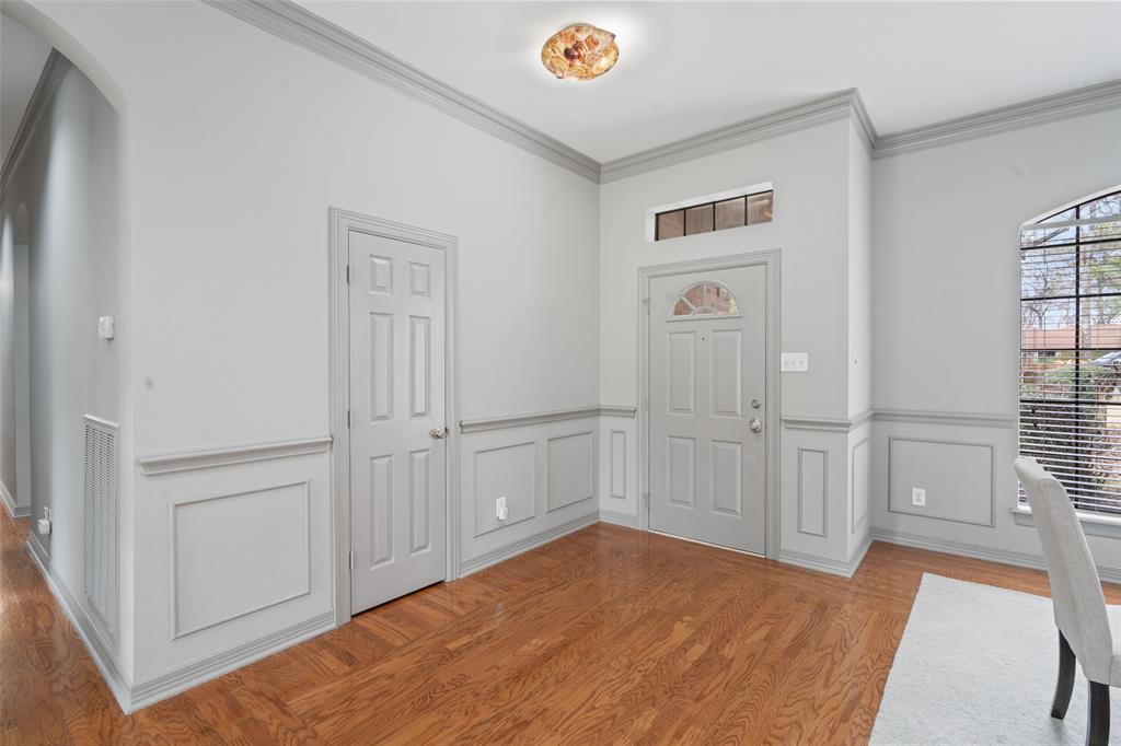 .As you enter the home, take a moment to appreciate the intricate woodwork and elegant crown molding.