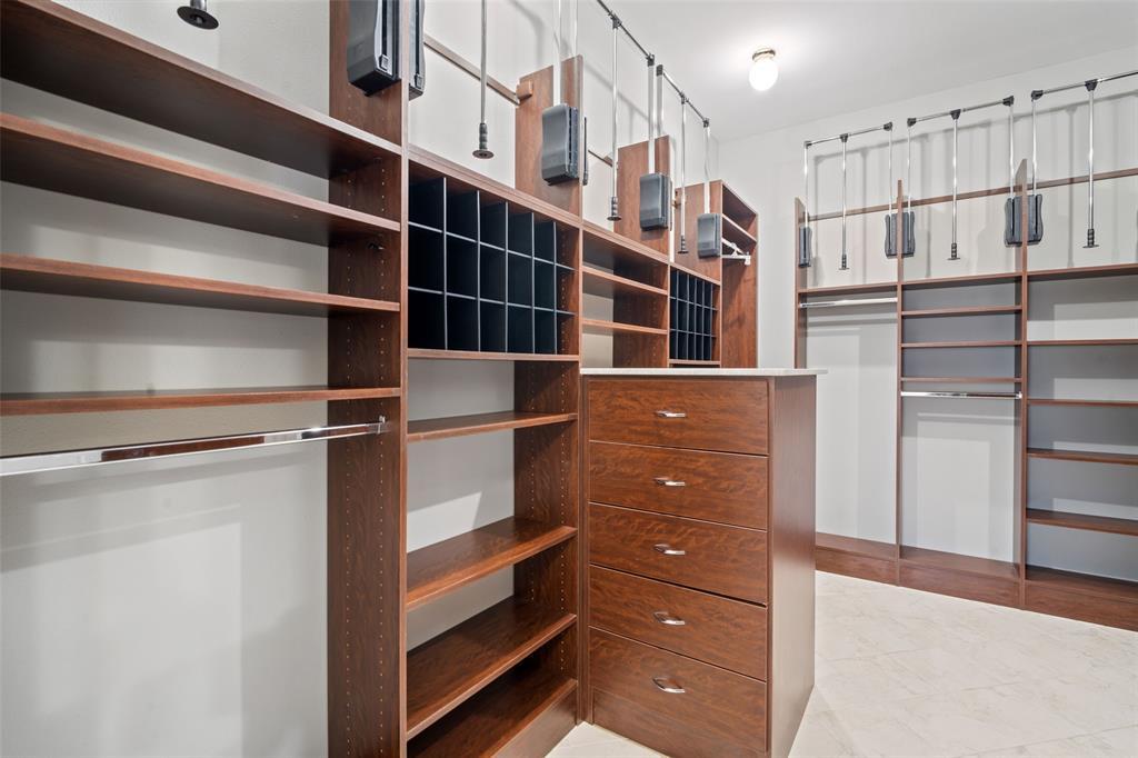 Take a look at the spacious primary closet, featuring amazing built-ins, and ready for a new owner.