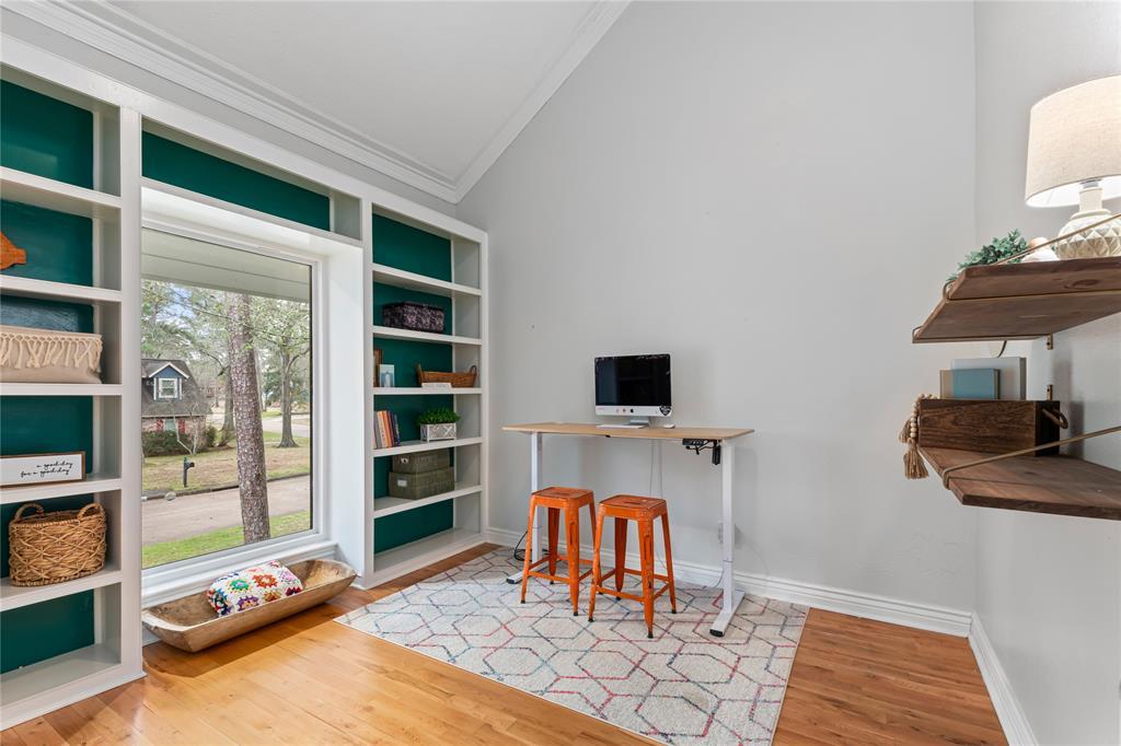 Great office space or game room that features a large window bringing in lots of natural light!