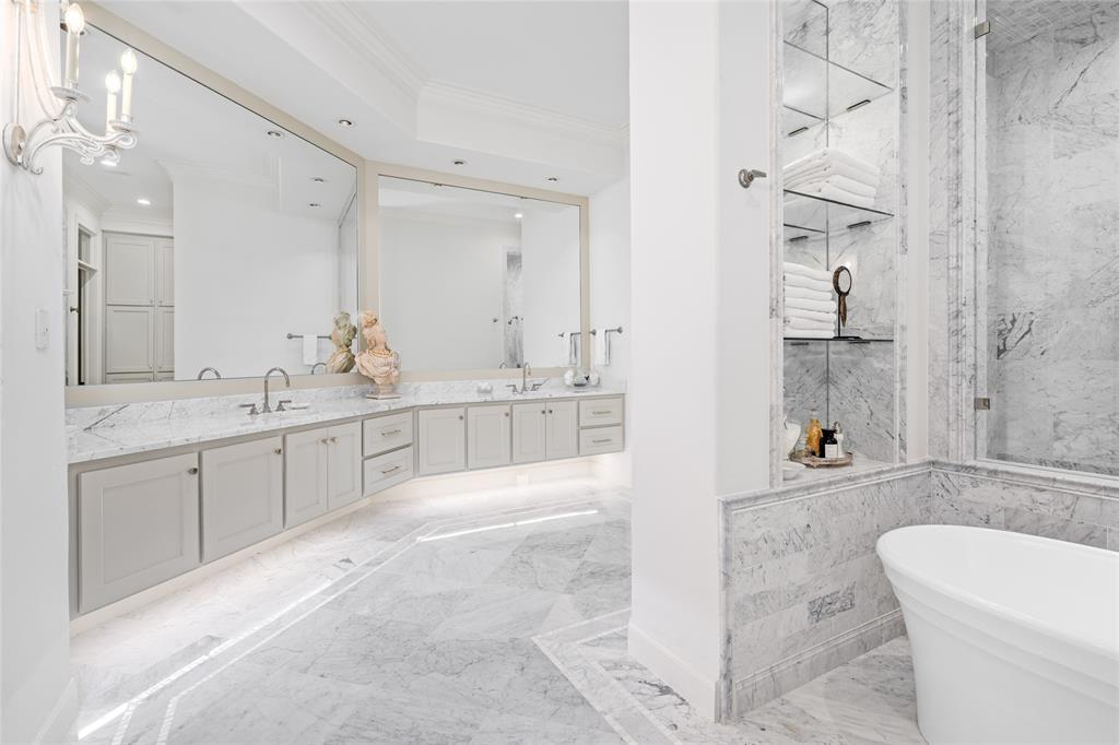 This is truly an amazing primary en-suite with elegant marble and mother of pearl finishes throughout.