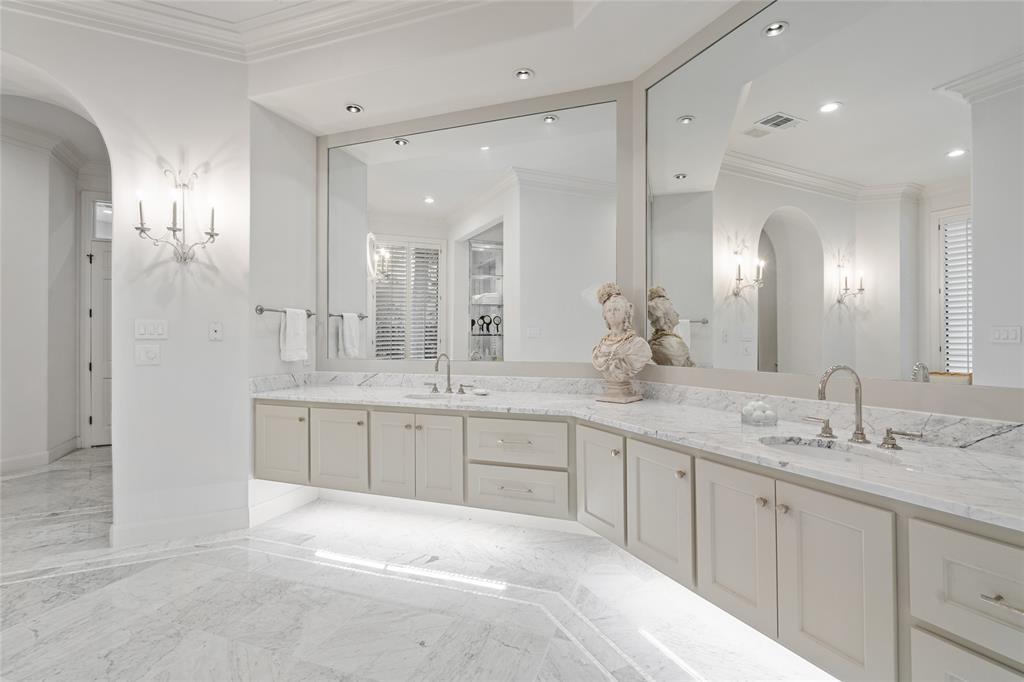 The sophisticated doorway arches and floating under-lit vanity are testament that no detail was overlooked.